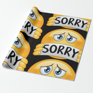 Papier Cadeau Visage d'émoji triste et désolé tenant un panneau