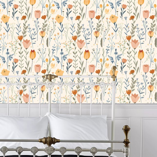 Papier Peint Fleurs sauvages Cottagecore (Cottagecore Wildflowers Wallpaper behind a white metal bed frame. )