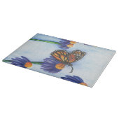 Papillon dans la planche à découper de fleurs (Coin)