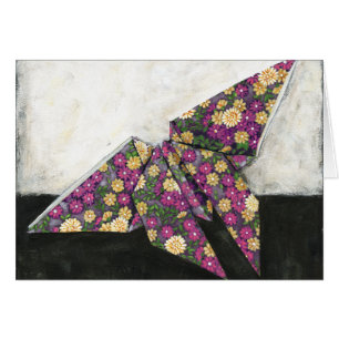 Papillon d'origami sur le papier floral