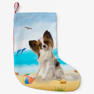 Papillon-hond op het strand kleine kerstsok
