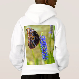 Papillon morpho bleu sur T-shirt orchidée marécage