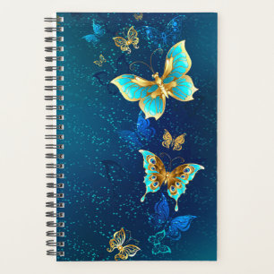 Papillons d'or sur un Arrière - plan bleu