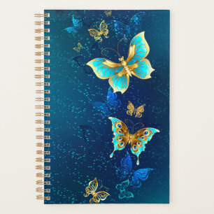 Papillons d'or sur un Arrière - plan bleu