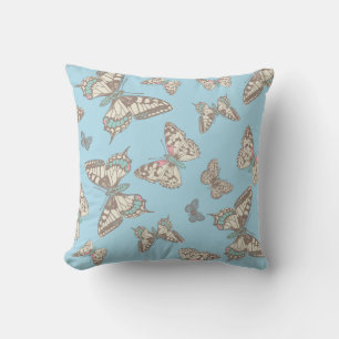 Papillons motif graphique bleu brun coussin