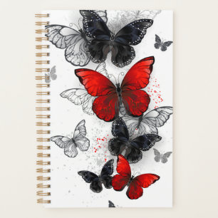 Papillons noirs et rouges volants