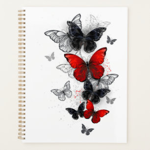 Papillons noirs et rouges volants