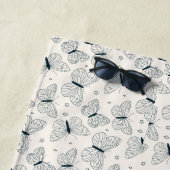 Papillons pour sa serviette de plage verte et blan (En situation)