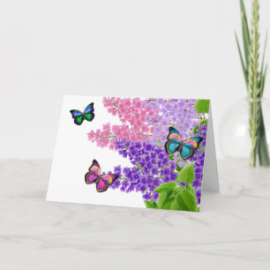 Papillons sur la carte de voeux de lilas