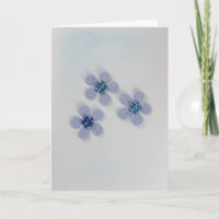 Pas blauwe bloemen aan met glanzende decoratie