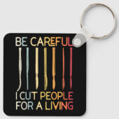 Pas op dat ik mensen snij voor een levende, grappi sleutelhanger (Achterkant)