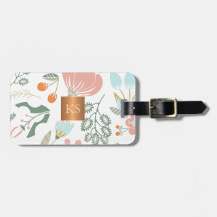Pastel wilde bloemen met metallisch koper monogram bagagelabel