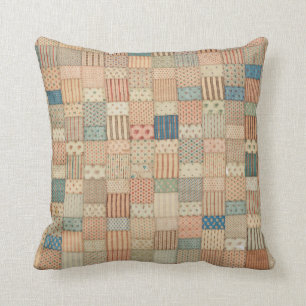 Patchwork quilt in gedempte kleuren kussen