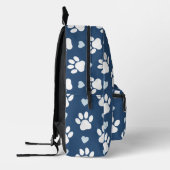 Patroon van poten, reuzenpoten, witte poten, blauw bedrukte rugzak (Links)