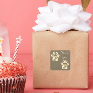 Patte mignonne sur un autocollant carré Merci