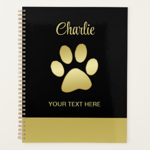 Paw chien brillant or sur arrière - plan noir