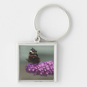 Peacock-vlinder op bloem sleutelhanger