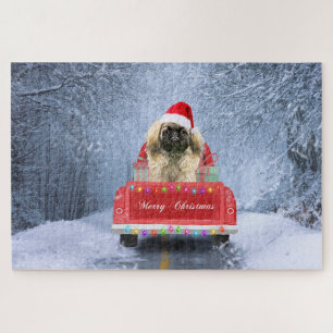 Pekingees in de Sneeuw zittend in Kersttruck  Legpuzzel
