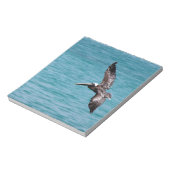 Pelican in vlucht notitieblok (Gedraaid)