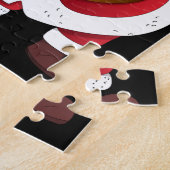 Père Noël avec puzzle cadeaux. (Côté)