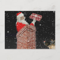 Père Noël dans la carte postale de la cheminée