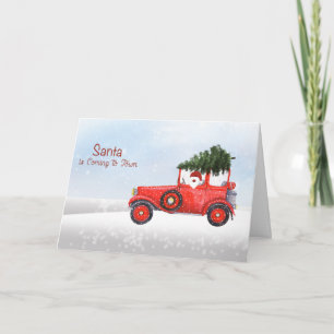 Père Noël de Noël en camion avec une carte de Noël