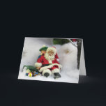 Père Noël prend une carte de voeux de tambours<br><div class="desc">Père Noël a peut-être fait une chute dans la neige,  mais un jeune garçon gentil est là pour l'aider.</div>