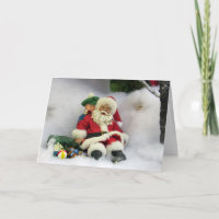 Père Noël prend une carte de voeux de tambours