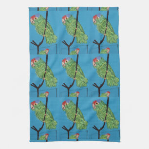 perroquets verts sur la serviette de cuisine bleue
