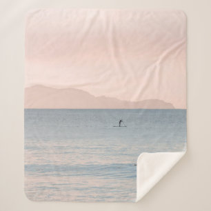 PERSON PADDLE BOARDING SHERPA DEKEN