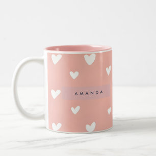 Persoonlijk hartpatroon op roze achtergrond tweekleurige koffiemok