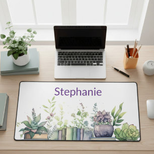 Persoonlijke waterverfboeken en planten bureaumat