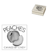 Perziken in het thuisconservenblikveld van perzike 	rubberstempel (Gestempeld)