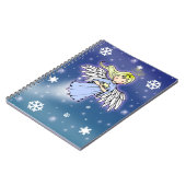 Petit ange d'hiver dans un cahier de neige (Côté gauche)