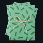 Petit pin bouge le papier d'emballage de Noël<br><div class="desc">Papier d'emballage de Noël avec boucles de pin vert sur un arrière - plan vert clair.</div>