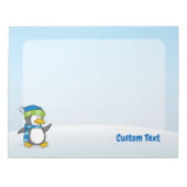 Petit pingouin marchant sur bloc-notes neige (Devant)