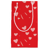 Petit Sac Cadeau Coeurs roses flottants sur le rouge (Devant)