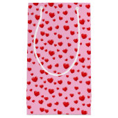 Petit Sac Cadeau Coeurs rouges éparpillés sur rose (Devant)