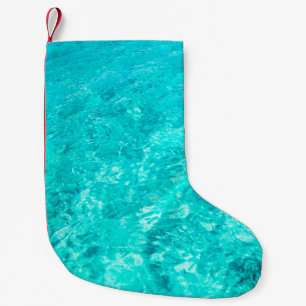 Petite Chaussette De Noël Arrière - plan turquoise de la piscine d'eau