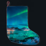 Petite Chaussette De Noël Aurora borealis over the sea coast, snowy mountain<br><div class="desc">Aurora borealis over the sea coast, snowy mountains and city lights at night. Northern lights in Lofoten islands, Norway. Starry sky with polar lights. Winter landscape with aurora reflected in water aurora, borealis, landscape, norway, light, northern, winter, arctic, north, pole, lake, iceland, nature, mountain, city, house, ice, nordic, beautiful, lofoten,...</div>