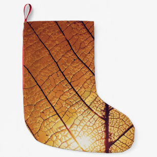 Petite Chaussette De Noël Brown and white leaf print textile
