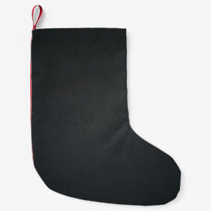 Petite Chaussette De Noël Le textile noir en gros plan photographie