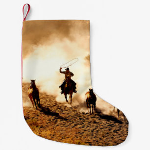Petite Chaussette De Noël Les cow-boys à la recherche de chevaux sauvages. l