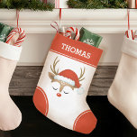 Petite Chaussette De Noël Monogramme rouge renne de Noël Stocking<br><div class="desc">Un joli sac de Noël rouge et blanc avec un visage de renne avec un chapeau de Père Noël. Idéal pour les enfants ! Personnalisez-le pour votre enfant pour Noël. Conçu pour vous par Blackberry Boulevard</div>