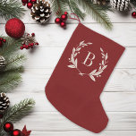 Petite Chaussette De Noël Monogramme rustique de couronne de laurier rouge<br><div class="desc">Bas de Noël monogrammé sur mesure avec un style rustique imitation burlap. Veuillez noter que la conception du faux burlap est imprimée sur le tissu, le stockage n'est pas fait de matériel de burlap. Personnalisez-le avec votre nom ou tout autre texte personnalisé dans un cadre de couronne de laurier. Cliquez...</div>