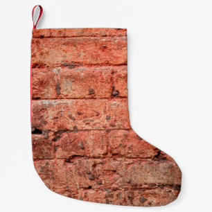 Petite Chaussette De Noël Mur vintage en brique avec quelques pierres dedans