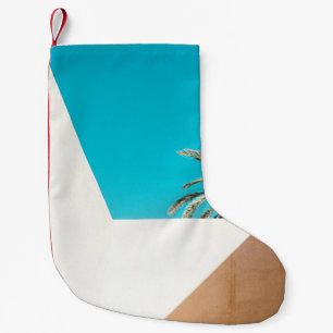 Petite Chaussette De Noël Palmier vert sous ciel bleu le matin