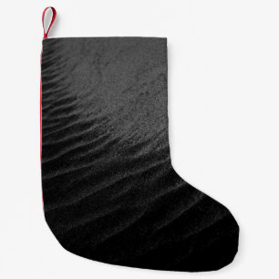 Petite Chaussette De Noël Photographie en niveaux de gris du sable