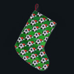 Petite Chaussette De Noël Soccer Ball Santa Hat Motif sur Vert<br><div class="desc">Bal de soccer festif dans un chapeau de Père Noël sur des ornements Motifs verts, des cadeaux et des décorations de vacances amusantes présentent notre art original d'un ballon de football noir et blanc tout décoré pour les vacances avec un chapeau de Père Noël rouge dans un motif répété contre...</div>