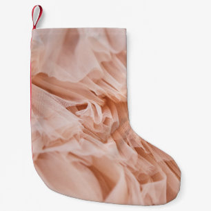 Petite Chaussette De Noël Tissu rose Pastel : Textures Élégantes.